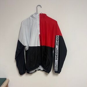 Red, white and black windbraker